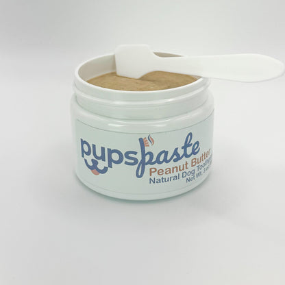 Peanut butter dog toothpaste jar with toothbrush applicator