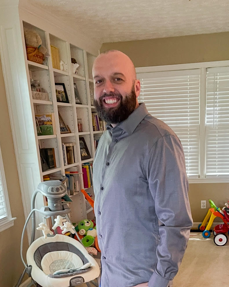 Person standing indoors.